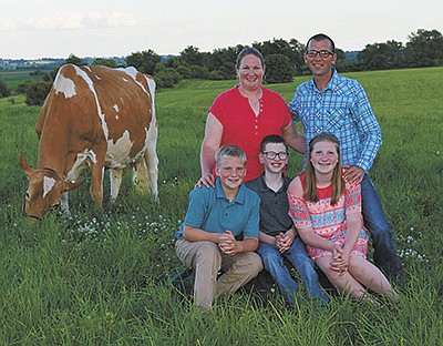 The Dindermans – (front, from left) Amery, Aidan and Alaina; (back, from left) Kristi and Brian – milk 80 cows on their farm near Orangeville, Illinois. The family is pictured with their EX-96 World Dairy Expo Reserve Grand Champion Hi-Guern-View Dancing Diva. PHOTO SUBMITTED