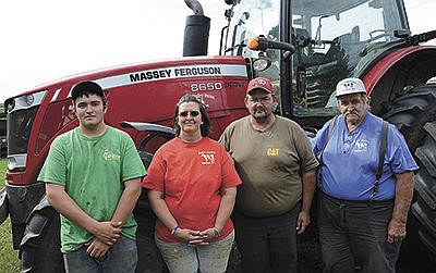 Brandon Higgins (from left), Kerry Higgins, Keith Zastrow and Tom Zastrow milk 170 cows near Bonduel, Wisconsin.   PHOTO BY STACEY SMART
