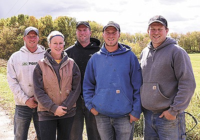 The Piepers – (front, from left) Emily, Nick and Brian; (back, from left) Dan and Tim – farm together with their parents, Ray and Bridget, on their 450-cow dairy, Metogga Lake Dairy, near New Prague, Minnesota. The family’s herd has a rolling herd average of 30,330 pounds of milk with 1,225 pounds of fat and 985 pounds of protein.  PHOTO BY KRISTA KUZMA
