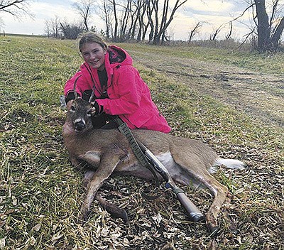 Lynnea Maus poses with her four-point buck she shot during Minnesota’s deer opener weekend Nov. 7 at her family’s farm near Osakis, Minnesota. This was Maus’ sixth deer season.  PHOTO SUBMITTED