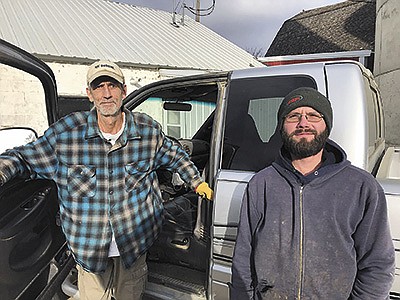 Dale Swanson (left) recently helped Kyle Moser get a start in the dairy business by leasing out his unused dairy facilities near Tyler, Minnesota. Moser has been milking his 40-cow herd on the farm since the last week of November.  PHOTO BY JERRY NELSON