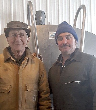 Gene (left) and Donald Bitzer milk 90 cows on their Northern Minnesota dairy, located on the shores of Lake of the Woods. The father-son duo is challenged with a unique climate and lake effect, and also a lack of dairy industry infrastructure because of their northern location.  PHOTO SUBMITTED