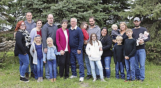 The Marschall family – (front, from left) Emily Miller, Kinley Graber, Katum Graber, Taryn, Trevyn, and Tucker; (back row from left) Trent, Tanya Graber, Justin Graber, Michelle, Rick, Tad holding Taya, Tiff, Kally holding Taten, and Travis holding Taylin – is the 2020 Scott County Farm Family of the Year. They milk 155 cows near Shakopee, Minnesota. This picture was taken before Michelle passed away from amyotrophic lateral sclerosis in March 2020.  PHOTO SUBMITTED