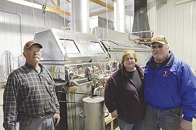 The Staats family – (from left) Ken, Deb, and Ed – own and operate CVF Maple, which produces about 1,000 gallons of maple syrup every year. The business is located at Country View Farms, the dairy run by Ed and Deb, who milk 450 cows and crop 2,000 acres near Sturgeon Bay, Wisconsin. Not pictured is Ken’s wife, Margie. PHOTO BY STACEY SMART