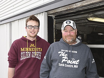 Isaac Kulzer works with his dad, Greg, on their family’s 74-cow dairy in Stearns County near Greenwald, Minnesota.  PHOTO BY MARK KLAPHAKE