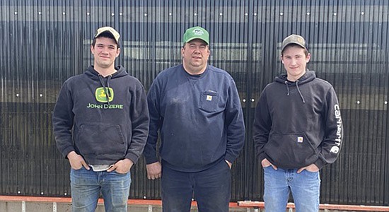Troy DeRosier (middle) pictured with his son, Jordan DeRosier, (left) and employee Alex Williams, fell into the 2 million gallon manure pit underneath the freestall barn March 20 on his farm Crystal Ball Dairy Farm in Osceola, Wisconsin. DeRosier was partially submerged in 9 feet of manure for 45 minutes before being rescued by Jordan and Williams.  PHOTO BY JASON SCHULTE FOR DAIRY STAR