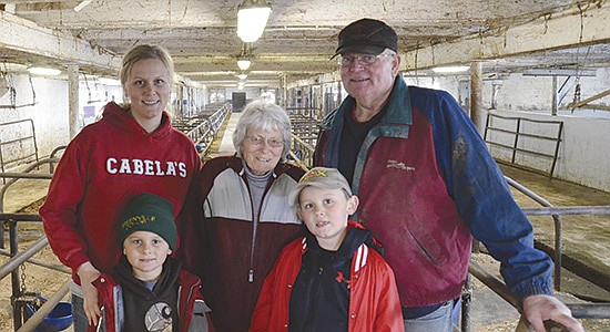 Mary Jo and Larry Plamann (back, right) along with their daughter, Abby Hopfensperger, and her sons, Rennin (left) and Ruxin, milk 70 cows and farm 430 acres near Appleton, Wisconsin. Abby returned to the family farm in 2019 after an 18-year career in the credit union industry. Not pictured is Larry’s brother, Keith Plamann. PHOTO BY STACEY SMART