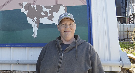 Adam Faust milks 70 cows and farms 200 acres near Chilton, Wisconsin. Faust was born with spina bifida which causes weakness in his legs and problems with walking and balance. He also has two prosthetic legs after losing both limbs from the knee down. PHOTO BY STACEY SMART