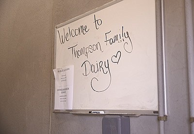 A message on a white board greets people to the farm site the Thompson family recently purchased April 8. It is a neighboring farm to their original farm site near Lewiston, Minnesota. PHOTO BY KRISTA KUZMA