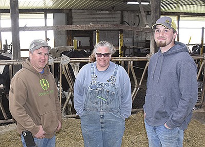 The breeding crew at Sandhill Dairy includes (from left) Bob Dombeck, Deanna Hartmann and Devin Meyer. The dairy milks 350 cows near Perham, Minnesota.  PHOTO BY MARK KLAPHAKE