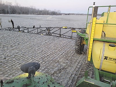 Early-season liquid nitrogen is applied March 15 on frozen ground to feed the rye crop to boost forage yield and quality.  PHOTO SUBMITTED