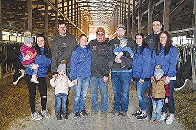 Deb and Kevin Kirsch (center) along with their family – (from left) Stacey holding Lexi, 2, Joel and Emma Knoener, 4; Nick holding Malcolm, 9 months, and Kendra Horst; Tylor, Jessica and Deklyn Wolfert, 3 – milk 200 cows and farm 700 acres near Elkhart Lake, Wisconsin. The Kirsches will be hosting Sheboygan County’s Breakfast on the Farm June 19.  PHOTO SUBMITTED