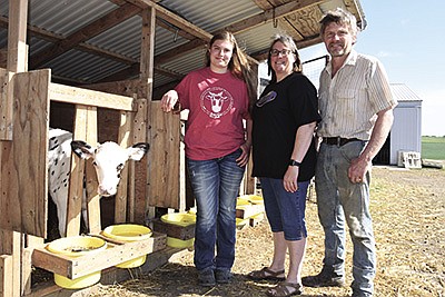 The Blonigens – (from left) Victoria, Judy and Willy – milk 61 cows near St. Martin, Minnesota. Victoria helps feed calves and youngstock, scrape gutters and milk the cows.  PHOTO BY MARK KLAPHAKE/DAIRY STAR