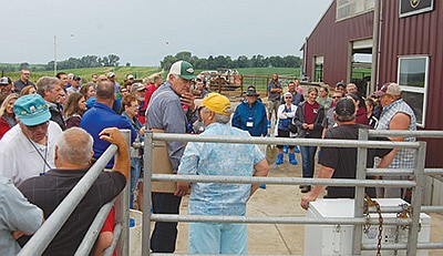 Members of Wapsiana Dairy prepare to give a tour to those who attended their farm tour June 24 near Anamosa, Iowa. The tour was part of the National Jersey Convention held June 23-26 in Bettendorf, Iowa.