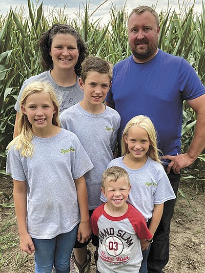 Amanda and Derek Zigan and their children – (front) Alec; (back, from left) Chloe, Jax and Jovi – milk 130 cows near Long Prairie, Minnesota. PHOTO SUBMITTED