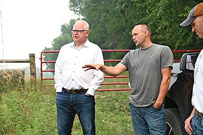 Mike Roers describes the field conditions to Gov. Tim Walz during a farm tour July 29 at Roers’ dairy in Douglas County near Brandon, Minnesota. The tour was an opportunity for state leaders to see the drought conditions and discuss options for assistance from state and federal governments. PHOTO BY JENNIFER COYNE
