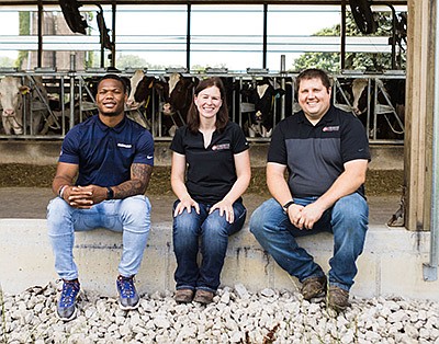 Chicago Bears running back David Montgomery (from left) visits with Sarah and Andy Lenkaitis on their dairy farm near St. Charles, Illinois. Montgomery visited the farm to do a video and photo shoot for the Fuel Up To Play 60 program. PHOTO COURTESY OF JESSIE HEARN PHOTOGRAPHY
