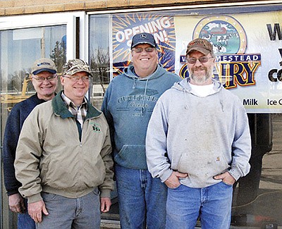 A photo from 2011 shows plant manager Bruce Snitker and owners Paul Weighner, Tom Walleser and Tom Weighner, of WW Homestead Dairy, outside the creamery before it began processing milk that spring.  DAIRY STAR FILE PHOTO
