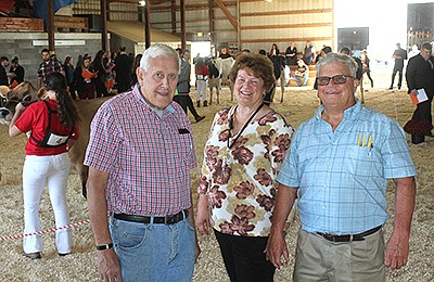 Lead volunteers – (from left) Roger Hanson, Janet Keller and Dr. Ole Meland – help coordinate the annual collegiate dairy judging contest Sept. 19 in Viroqua, Wisconsin. This year was the 27th year the Vernon County Dairy Cattle Judging Contest took place.  PHOTO BY DANIELLE NAUMAN