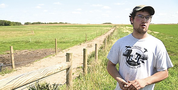 Jack Schouweiler explains his grazing system during a field day Sept. 9 at his farm in Douglas County near Brandon, Minnesota. Shouweiler milks 70 cows.  PHOTO BY JENNIFER COYNE