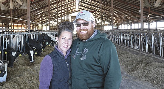 Lisa and Dan Madden milk 400 cows and farm 650 acres near New London, Wisconsin. Lisa, a former bartender, became Dan’s right-hand man nearly three years ago when the farm was faced with an employee shortage. PHOTO BY STACEY SMART