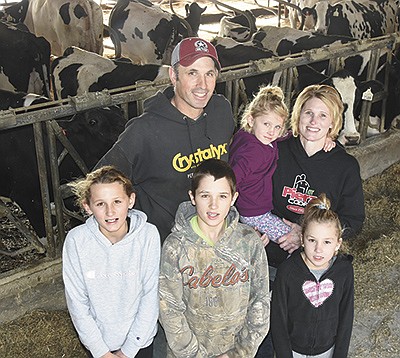 Kent and Stacy Happke and their children – (from left) Hayden, Carter, Sydney and Kensie – milk 100 cows near Pierz, Minnesota. PHOTO BY STACEY SMART