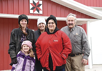 The Larsons – (front, from left) Mckenna and Dori; (back, from left) Melissa, Ellen Dilly and Ken – milk 65 cows on their organic dairy near Ottertail, Minnesota. They began milking with one robotic milker last winter. Not pictured are Todd, Trystan and Tanner Larson, and Luke, Lane, Addison and Mac Dilly.  PHOTO BY JENNIFER COYNE