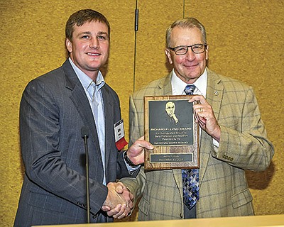 Alex Peterson (left), chairman of the National Dairy Board, presents the prestigious Richard E. Lyng Award to North Dakota dairyman Kenton Holle in Las Vegas, Nevada. Holle received the award in recognition of his many years of dairy promotion efforts. PHOTO COURTESY OF DAIRY MANAGEMENT INC