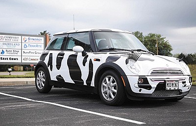 Moovin’ Mini is parked outside the Save Cows headquarters in Baraboo, Wisconsin. The Mini Cooper was wrapped to look like a Holstein cow as part of a youth outreach program started in 2019 by Melanie Burgi and Kimberly Evert. PHOTO SUBMITTED
