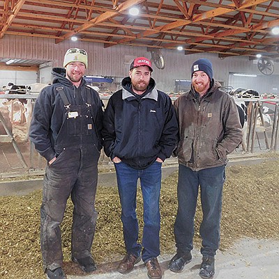 The Schaffer brothers – (from left) – Jeff, Jason and Justin – milk 210 cows in Dakota County near Miesville, Minnesota. The Schaffers installed the robots in May 2020.  PHOTO BY KATE RECHTZIGEL