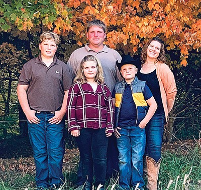 Jeff and Karla Mallery and their children – (from left) Eddie, Libby and Tommy – milk 250 cows with Jeff’s mom, Nancy, near Shafer, Minnesota. The Mallerys were named Minnesota’s Conservationist of the Year. PHOTO SUBMITTED