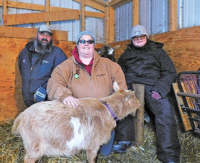 The Hovels – (from left) Brad, Kelly and Lily – milk seven goats near Cannon Falls, Minnesota. The Hovels also make and sell goat milk soap. PHOTO BY KATE RECHTZIGEL