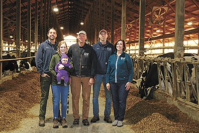 The Wise family – (from left) Ethan, Allie holding Della, Dave, Jared and Jean – milk 925 cows and farm 2,800 acres near Decorah, Iowa. For the past two years, the Wises have raised crossbreds and calved in about 600 head in 2021. PHOTO SUBMITTED