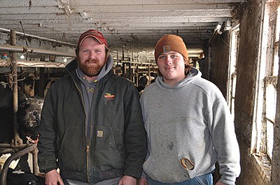 Brady Giese (left) and Colton Sluga stand inside Giese’s tiestall barn Jan. 6 near Whitehall, Wisconsin. Sluga has worked for the Gieses since 2016. PHOTO BY ABBY WIEDMEYER