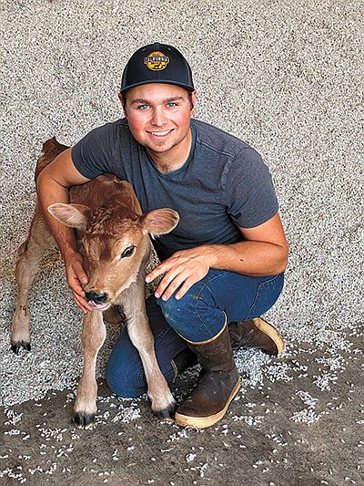Nevin Lemos poses with one of his Jersey calves on the dairy he began leasing in 2017 near Waterford, California. Lemos milks 400 cows and purchases his feed. PHOTO SUBMITTED