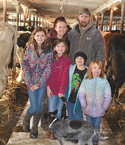 Kati and Levi Rasmussen and their children – (from left) Madi, Annabelle, Levi and Charlotte – milk 68 cows on their dairy farm in Monroe County near Norwalk, Wisconsin. PHOTO BY ABBY WIEDMEYER