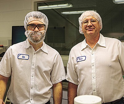 Sam Ellingson (left) and Dave Schoh are both quality control laboratory technicians at the dairy plant in LaCrosse, Wisconsin. PHOTO SUBMITTED
