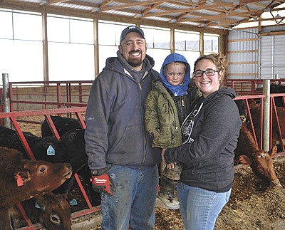 The Handels – (from left) Dylan, Clyde and Bryanna – stand in the heifer barn Jan. 27 on their farm near Barneveld, Wisconsin. Not pictured are Lyle, Roy and Elizabeth Handel.  PHOTO BY ABBY WIEDMEYER