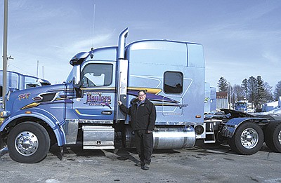 CEO Dennis Gavin is pictured next to one of Caledonia Haulers many trucks Feb. 15 near Caledonia, Minnesota. Caledonia Haulers was a finalist in the Best Fleets to Drive For contest.  PHOTO BY KATE RECHTZIGEL