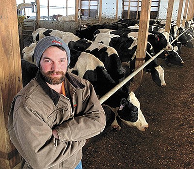 Bob Gruber stands in his freestall barn Feb. 17 on his 220-cow dairy near Lastrup, Minnesota. Gruber operates the farm with his wife, Kaylie. PHOTO BY MARK KLAPHAKE