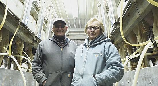 Lester and Donna Banse stand in their milking parlor Feb. 24 on their farm near Caledonia, Minnesota. At the peak in the couple’s career, they were milking 160 cows. PHOTO BY KATE RECHTZIGEL
