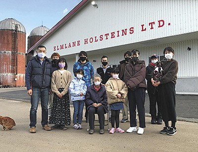 The Fukuya family – (front, from left) Hideto, Megumi, Eika, Toshico, Tomoka, Nagomi, and Akiyo – stand with employees and trainees at Elmlane Holsteins near Eniwa, Japan. The family milks 130 cows. PHOTO SUBMITTED