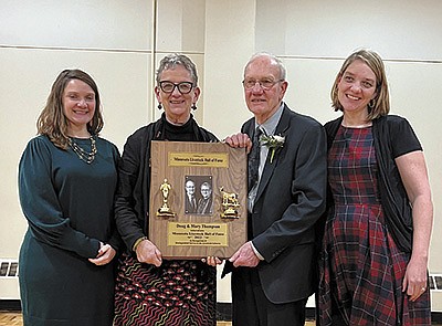 Mary and Doug Thompson (center) are pictured with their daughters – (from left) Emily and Anna – at the Minnesota Livestock Breeders’ Association banquet March 10. Mary and Doug were inducted into the association’s hall of fame. PHOTO SUBMITTED