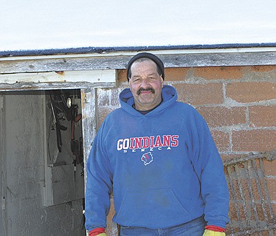 Arthur Wall stands outside his barn March 8 near Eastman, Wisconsin. Wall milks 30 organic cows and has no plans to expand. PHOTO BY ABBY WIEDMEYER