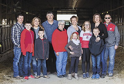 The family of Tri-Fecta Farms –  (front row from left) Reece Schultz, Rex Schultz, Londyn Schmidt, and Benson Gribble; (back row from left) Nick Schultz, Jodi Schultz, Keven Schultz, Cheryl Schultz, Katy Schultz, Isabel Gribble, Kari Gribble and Eric Gribble – milks 500 cows and runs about 2,000 acres near Fox Lake, Wisconsin. They began transitioning the farm to the next generation in 2002.  PHOTO SUBMITTED