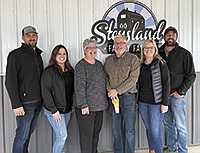 The Stensland family – (from left) Jason, Paige, Mona, Doug, Chelsea and Justin – dairy farm near Larchwood, Iowa. The Stenslands have found considerable success in retailing the dairy products that are made in their on-farm creamery. PHOTO BY JERRY NELSON