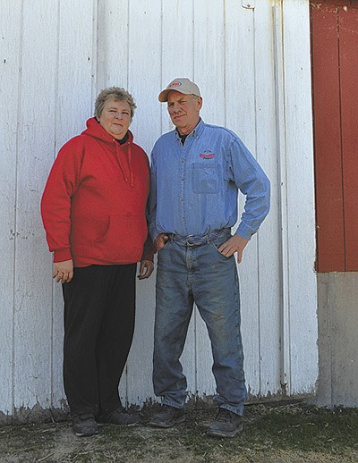 Jerry and Deb Nelson stand by their barn April 19 at their farm near Arena. The Nelsons milk 50 cows with their son, Kris. PHOTO BY ABBY WIEDMEYER