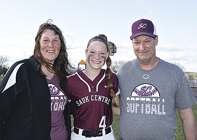Shari (from left), Lisa and Rick Weir gather after Lisa had an afternoon softball game May 9 in Sauk Centre, Minnesota. The Weirs milk 65 cows near Sauk Centre, Minnesota.  PHOTO BY MARK KLAPHAKE