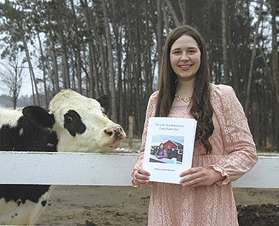 Mary Lewandowski is the author of a children’s book about her experiences growing up on a Wisconsin dairy farm as part of her FFA supervised agriculture experience. Lewandowski and her family dairy farm near Bevent, Wisconsin.  PHOTO BY DANIELLE NAUMAN