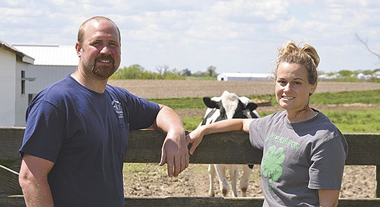 Nick and Tatum Wienen take a break by the pasture May 16 on their farm near Galena, Illinois. The Wienens returned to the dairy industry in 2021. PHOTO BY ABBY WIEDMEYER